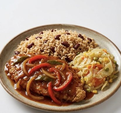 Escovitch Fish: Crispy fried fish seasoned to perfection, served with a side of tangy sauce for dipping.